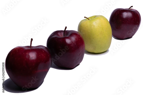 Three red apples and one green apple on a white background, isolated Apple. Be unique.