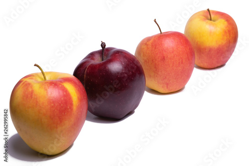 Three yellow apples and one red apple on a white background, isolated Apple. Be unique.