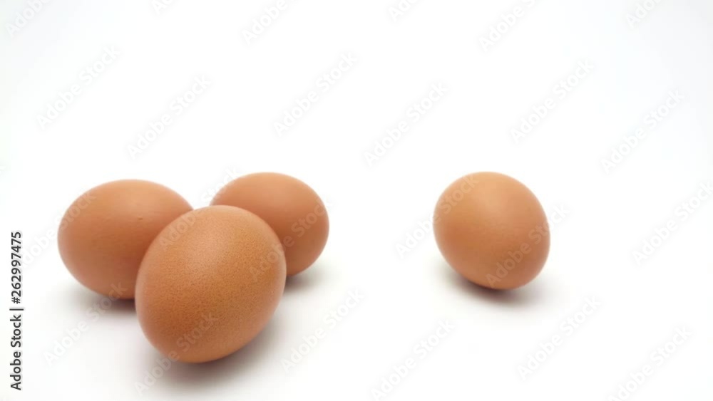 Slide Shot of the raw chicken eggs with yolk isolated on white background Slide Shot of the raw chicken eggs with yolk isolated on white background