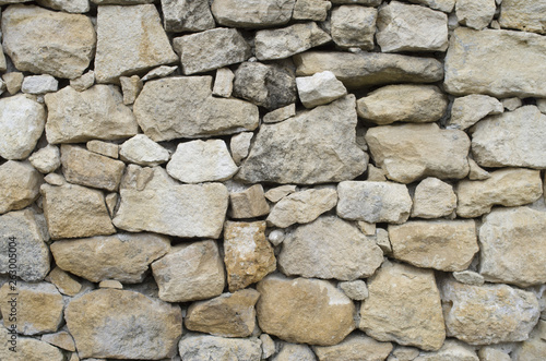 Old rural stone wall closeup