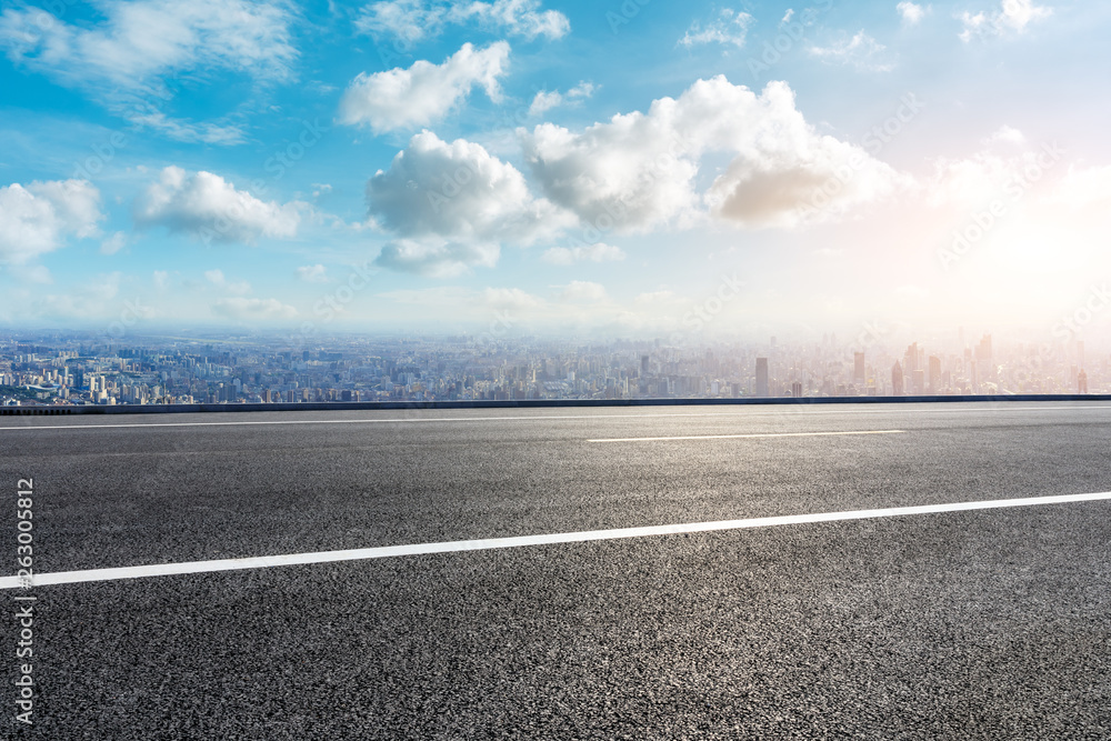 Fototapeta premium Shanghai city skyline and empty asphalt road scenery,China