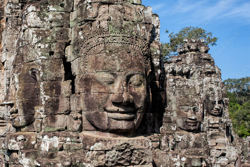 The faces  are only seen in the Angkor Thom. This big temple is part of the Angkor Wat complex near Siem Reap in Cambodia.