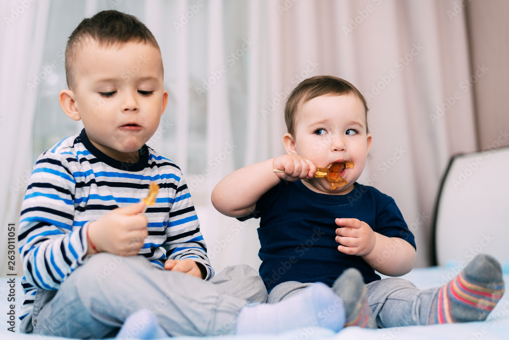 Brother and sister eat lollipops in the form of a cock Brother and sister eat lollipops in the form of a cock