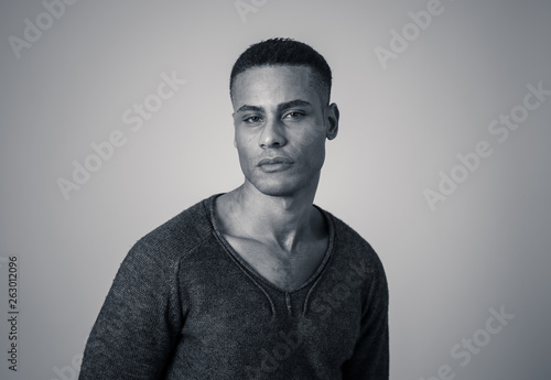 Fashion portrait of Attractive african american male model posing happy and sexy for the camera