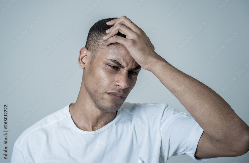 Young attractive man in pain with headache suffering migraines. Young attractive man in pain with headache suffering migraines.