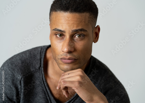 Fashion portrait of Attractive african american male model posing happy and sexy for the camera