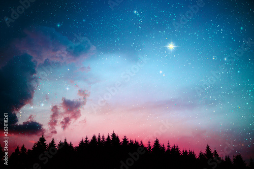 Colorful dramatic sky with stars . photo