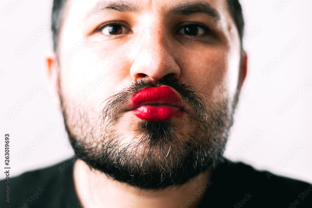 portrait of Bearded man with painted lips posing portrait of Bearded man with painted lips posing