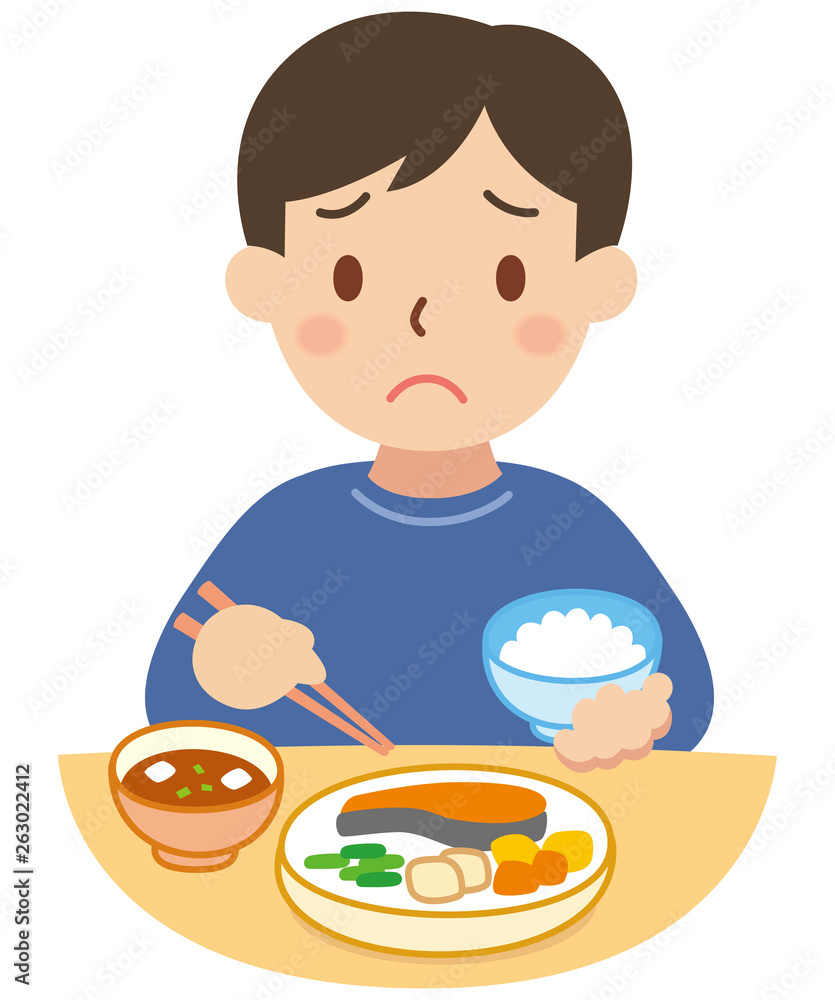 食事をする困り顔の男性 食事をする困り顔の男性