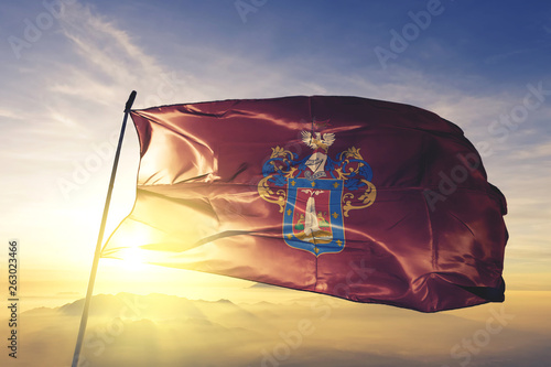 Canvas Print Arequipa region of Peru flag waving on the top sunrise mist fog