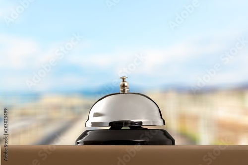 Hotel ring on wooden table background.