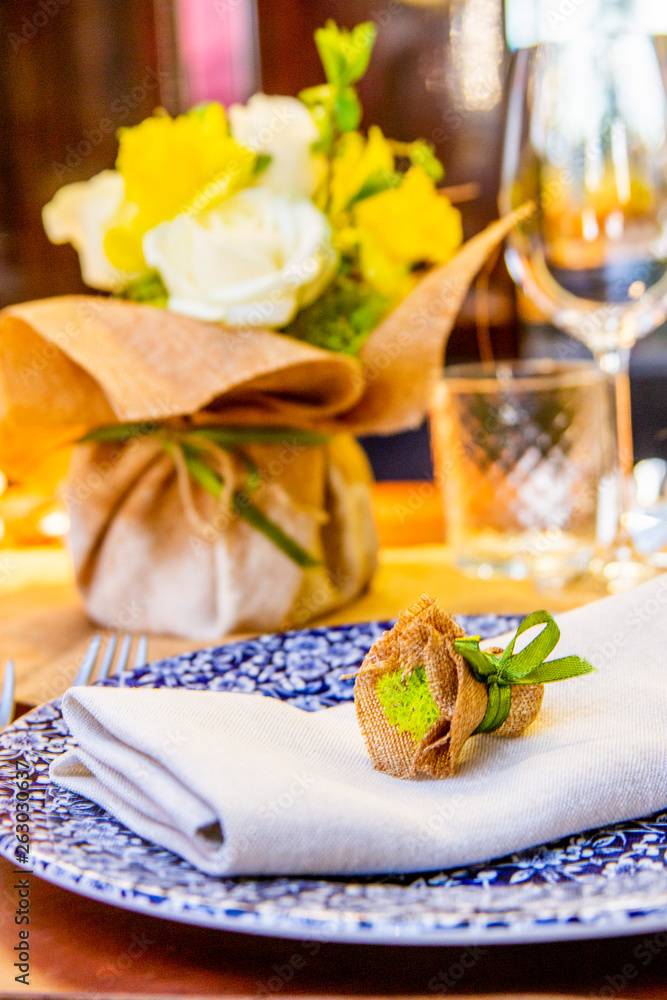 decorated with flowers table in yellow tones for a celebration (wedding, anniversary, birthday) in a restaurant or cafe decorated with flowers table in yellow tones for a celebration (wedding, anniversary, birthday) in a restaurant or cafe
