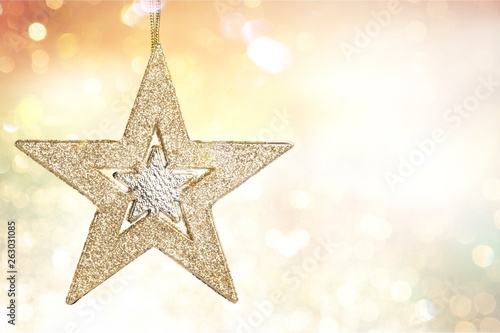 Golden Christmas star decoration on background