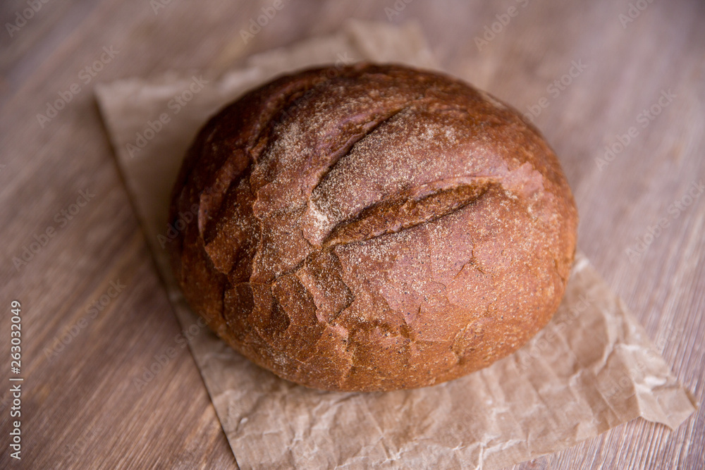 black bread on wooden background black bread on wooden background