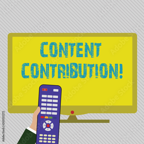 Text sign showing Content Contribution. Business photo text contribution of information to any digital media Hand Holding Computer Remote Control infront of Blank Wide Color PC Screen photo