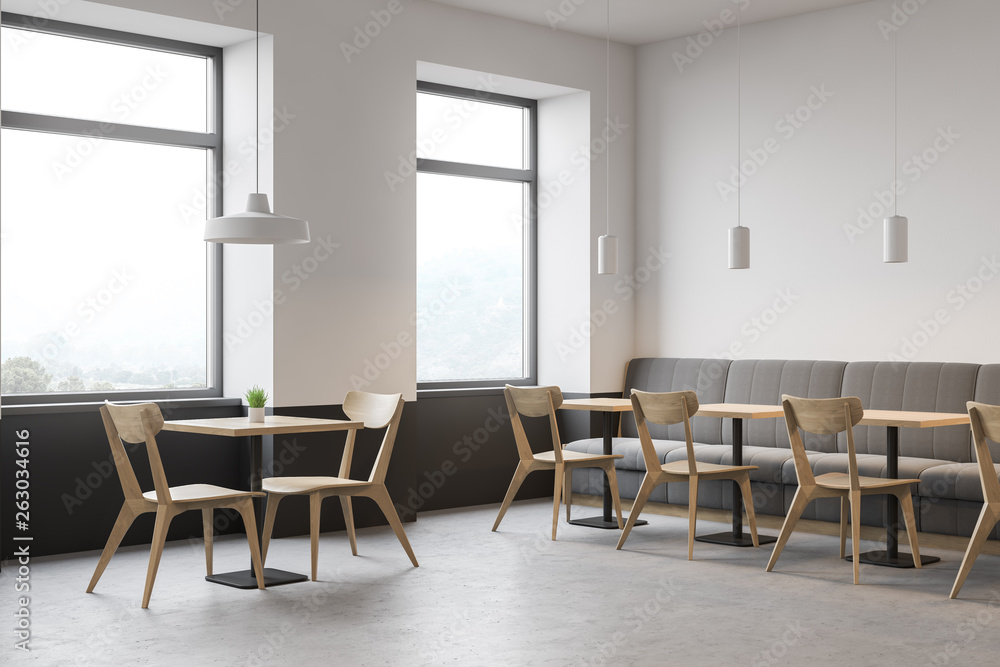 Fototapeta premium Corner of modern restaurant, sofa and chairs