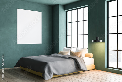 Green bedroom corner with poster