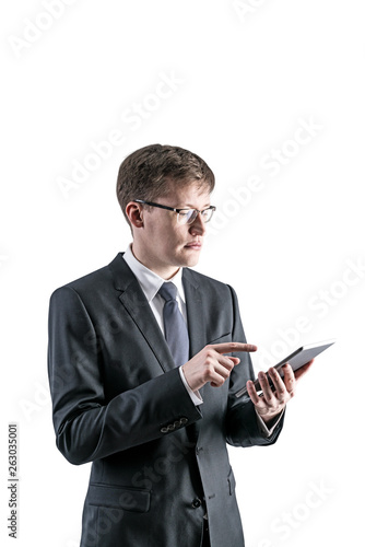 Serious businessman using tablet computer