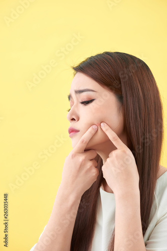 woman who checks her skin. acne treatment