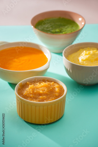 Homemade vegetable baby food purees in glass jars