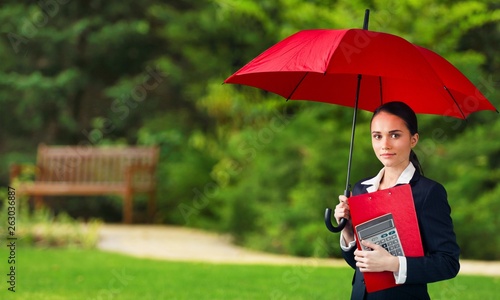Beautiful businesswoman portrait with umbrella , isolated.