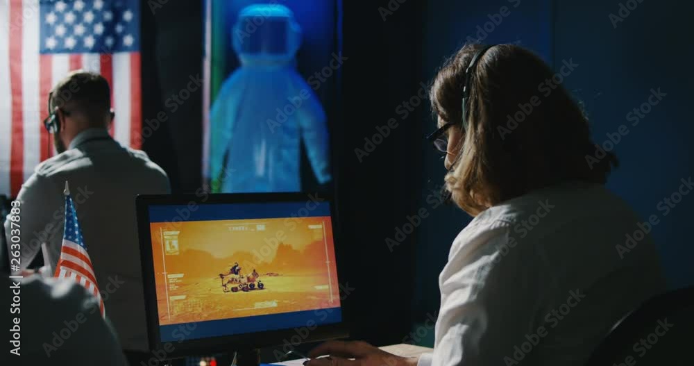 Mars mission technicians working at their desk Mars mission technicians working at their desk