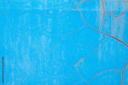 Blue old cracked rusty damaged painted metal background texture close-up