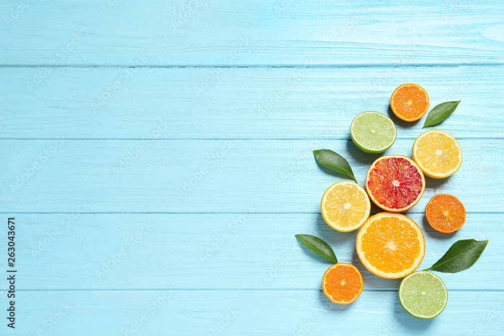 Flat lay composition with different citrus fruits and space for text on wooden background Flat lay composition with different citrus fruits and space for text on wooden background