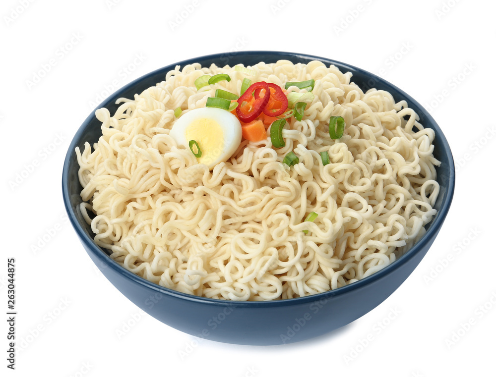 Tasty instant noodles with egg and vegetables in bowl isolated on white Tasty instant noodles with egg and vegetables in bowl isolated on white