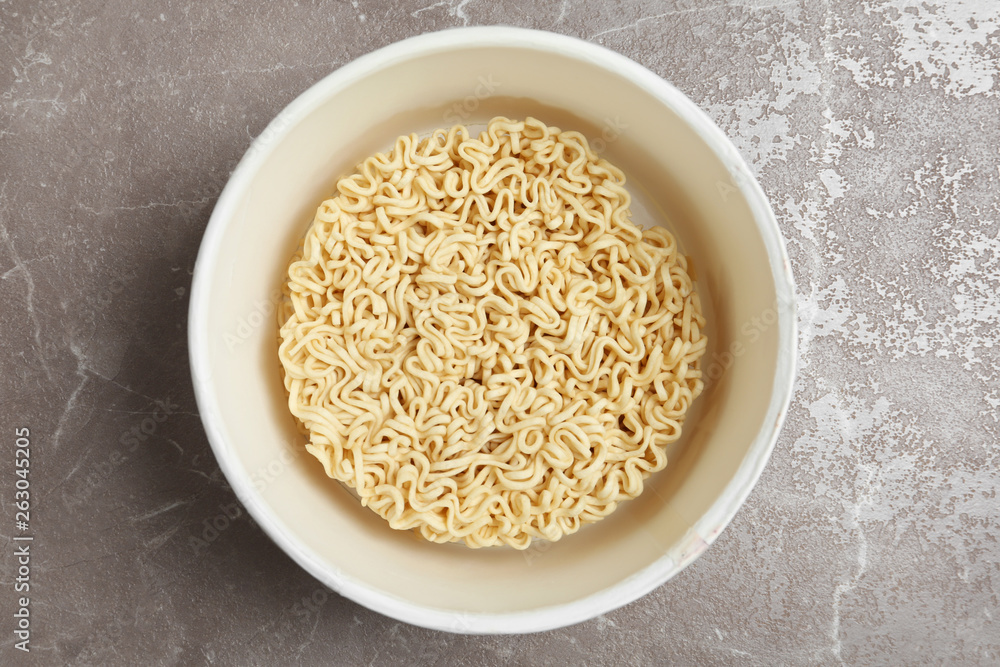 Cup of instant noodles on table, top view Cup of instant noodles on table, top view