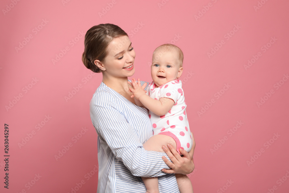 Portrait of happy mother with her baby on color background Portrait of happy mother with her baby on color background