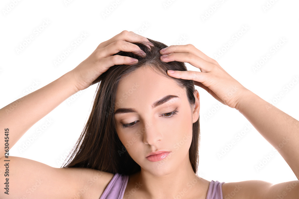 Young woman with hair loss problem on white background Young woman with hair loss problem on white background