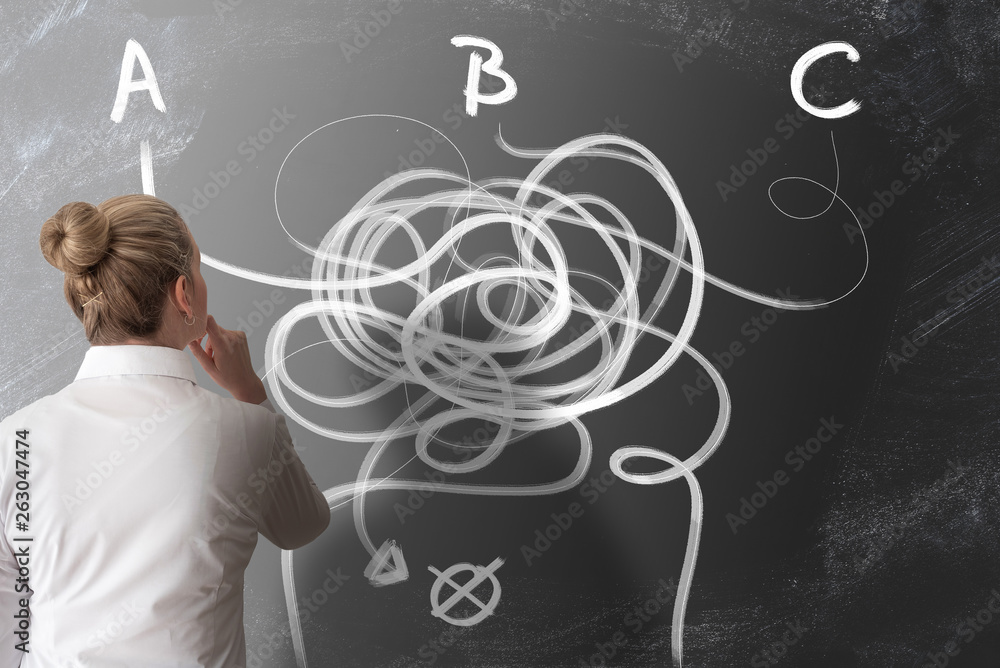 decision making concept with rear view of woman looking at chalkboard with arrows pointing in different directions decision making concept with rear view of woman looking at chalkboard with arrows pointing in different directions