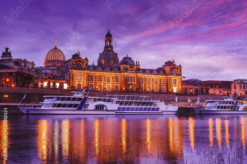 Wonderful Cityscape, The old town of Dresden with the river Elbe after sunset with colorful sky. Evening view of Academy of Fine Arts and Baroque church Frauenkirche cathedral. Creative image.