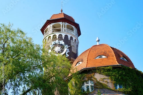 Russia, Svetlogorsk, 08. 10. 2017. The old water tower Rauchen, decorated with watches with stucco. selective focus. photo