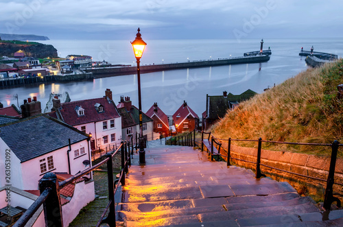 A view of the famous Whitby harbour from the 199 steps on the East cliffs leading to Whitby Abbey.