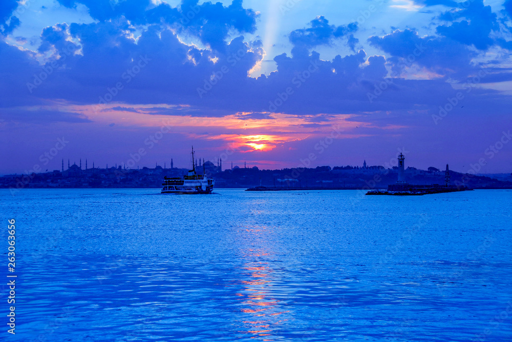 Fototapeta premium Istanbul, Turkey, 10 June 2007: City lines ferry, Sunset at Kadikoy