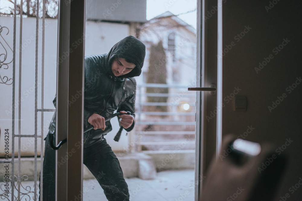 Burglary man breakeing in the apartment Burglary man breakeing in the apartment