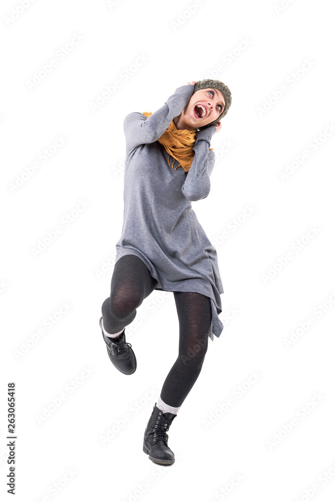 Excited young cool funky unique style girl dancing and singing loud. Full body isolated on white background. Excited young cool funky unique style girl dancing and singing loud. Full body isolated on white background.