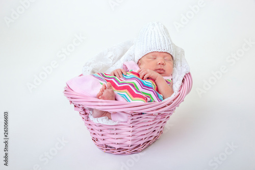 baby sleeping in basket