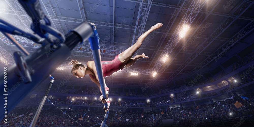 Ταπετσαρία Female athlete doing a complicated exciting trick on horizontal gymnastics bars in a professional gym