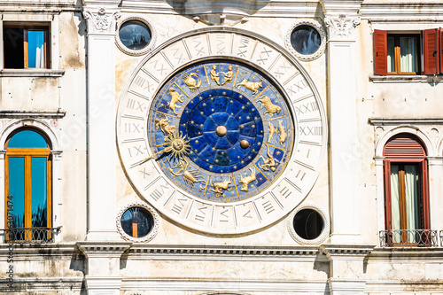 old clock with zodiac figures on St Mark's Clocktower at piazza San Marco in Venice, Italy