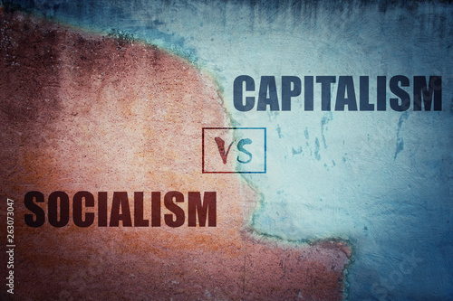 Socialism versus capitalism split concrete wall photo