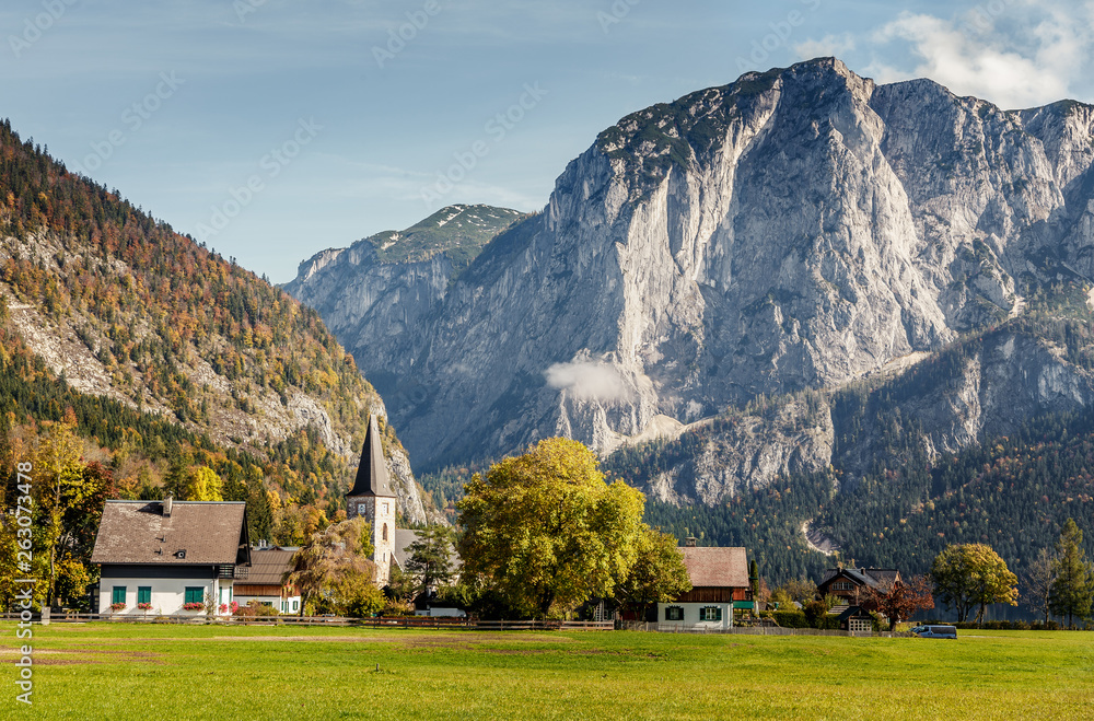 Wonderful Alpine Landscape. Austian Village with Roky Mountain on Background, incredible Autumn Scenery. Amazing Natural View. Vacation Concept. Salzkammergut's Mountains. Austria. Europe .