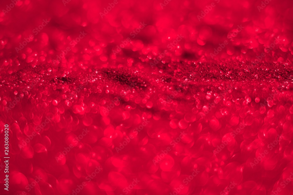red bright metall sand made of glitters - festival concept with bokeh texture - cute abstract photo background