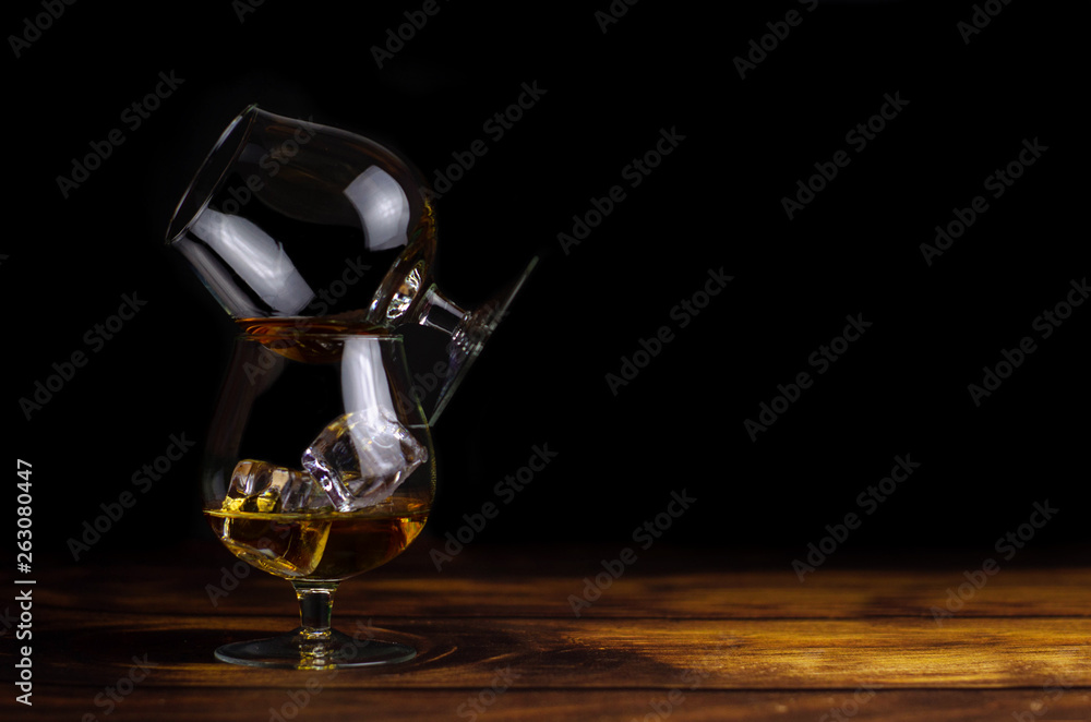 custom made wallpaper toronto digitalTwo whiskey / cognac glasses with ice on a wooden background. Dark backdrop.