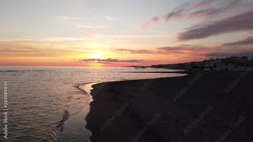 Impressive sunset over the sea with a fantastic sky and calm sea water reflects golden sun rays of the twilight Impressive sunset over the sea with a fantastic sky and calm sea water reflects golden sun rays of the twilight