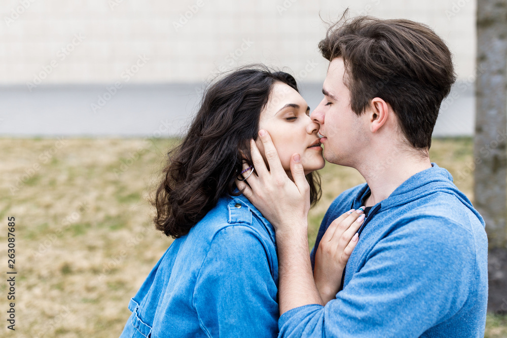 Young pretty couple - boy and girl spend time together. A romantic meeting of two young people Young pretty couple - boy and girl spend time together. A romantic meeting of two young people