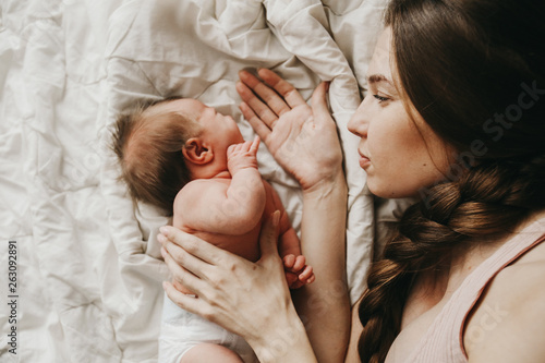 mother and her newborn baby, maternity concept, soft image of beautiful family