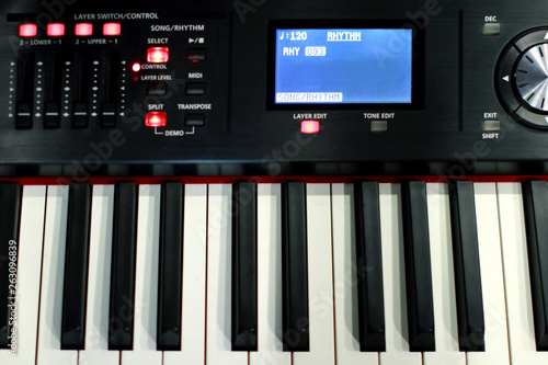 The synthesizer is in the recording Studio. Included electronic piano with burning scoreboard. Large white and black keys